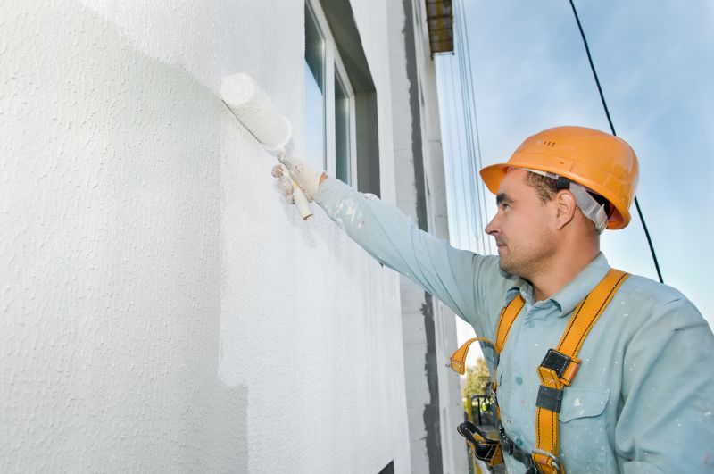 Exterior wall of a house being painted